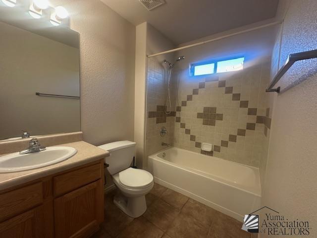 11144 E 26th Pl, Yuma, AZ 85367 - full bathroom featuring tile patterned flooring, vanity, shower / washtub combination, and a textured wall
