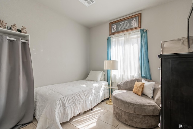 bedroom with light tile patterned flooring and visible vents