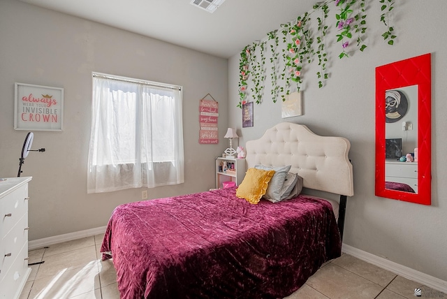 bedroom with light tile patterned floors, baseboards, and visible vents