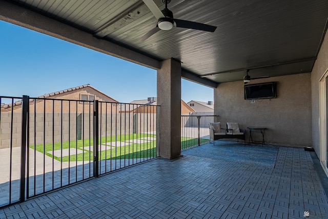 view of patio / terrace featuring a ceiling fan and fence private yard