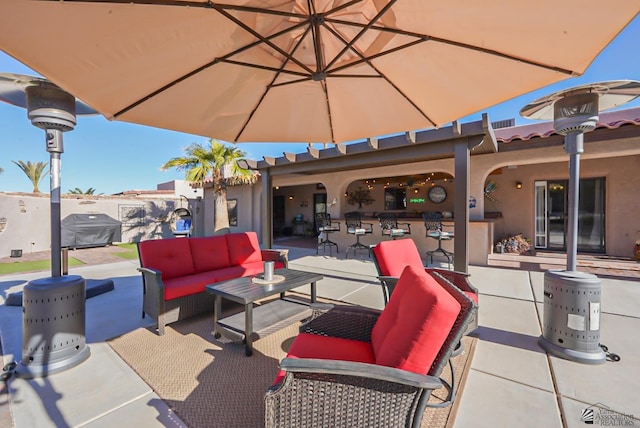 back of house with a bar and a patio