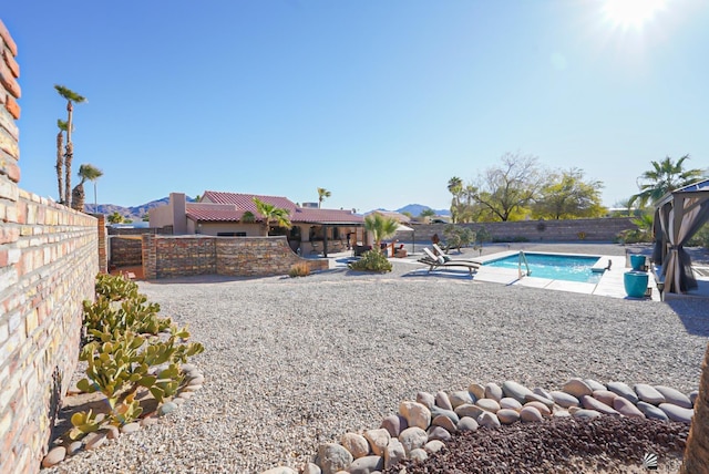 view of yard featuring a fenced in pool and a patio area