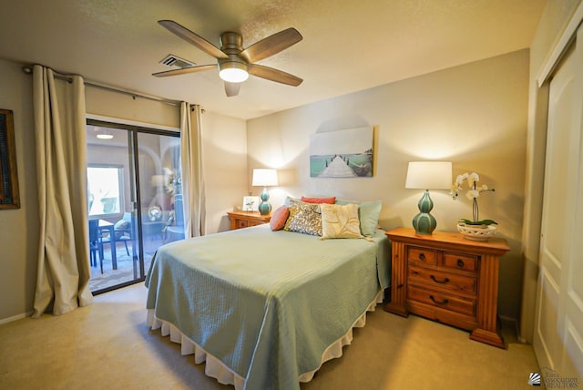 bedroom featuring ceiling fan and light colored carpet