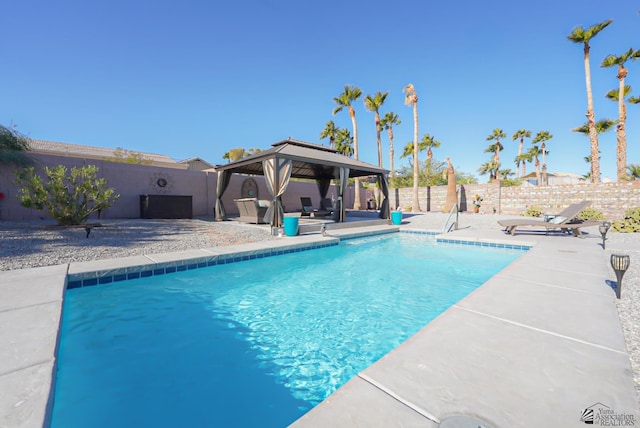 view of swimming pool with a gazebo and a patio