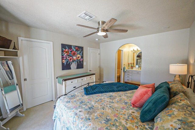 bathroom featuring ceiling fan, vanity, and a shower with shower door