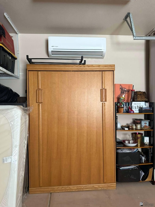 14551 E 49th St, Yuma, AZ 85367 - room details with concrete floors and a wall mounted air conditioner