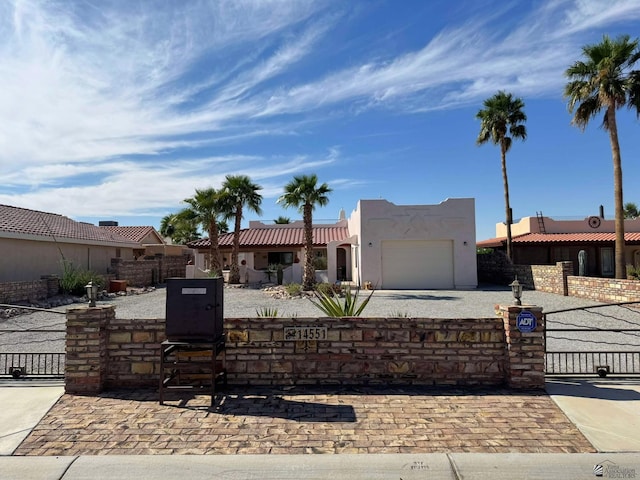 14551 E 49th St, Yuma, AZ 85367 - view of front of property with a garage, a gate, and a fenced front yard