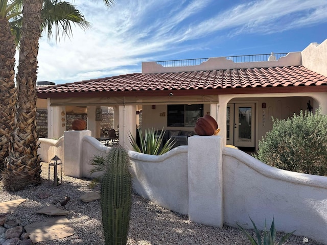 14551 E 49th St, Yuma, AZ 85367 - back of property featuring a tiled roof, fence, and stucco siding