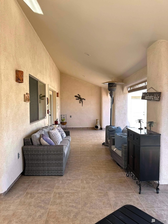 14551 E 49th St, Yuma, AZ 85367 - living room featuring a textured wall and vaulted ceiling