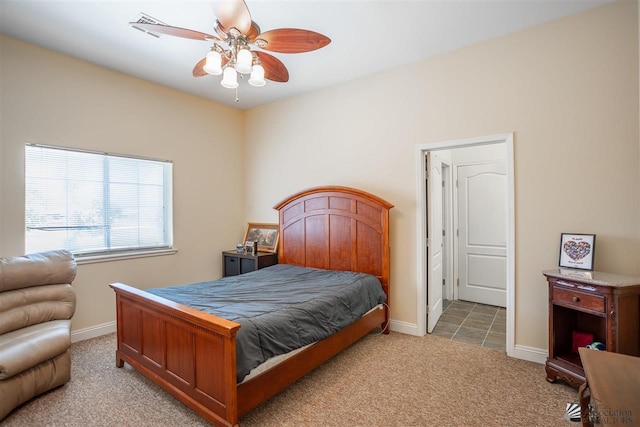 carpeted bedroom with baseboards and ceiling fan