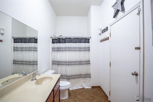 bathroom with vanity, tile patterned floors, toilet, and a shower with shower curtain