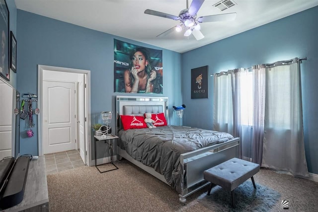 carpeted bedroom with baseboards, ceiling fan, and visible vents