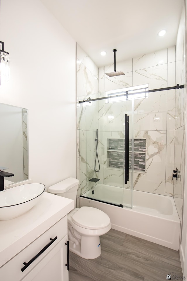 10660 E 45th Pl, Yuma, AZ 86367 - full bathroom featuring vanity, toilet, a combined bath / shower with rainfall shower, recessed lighting, and wood finished floors