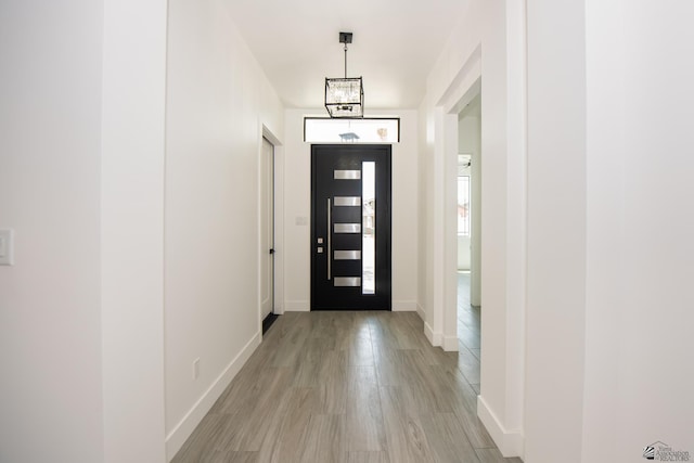 10660 E 45th Pl, Yuma, AZ 86367 - doorway featuring baseboards and light wood-style floors