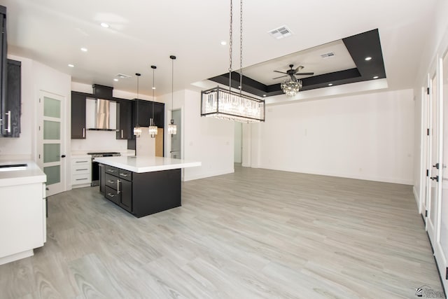 10660 E 45th Pl, Yuma, AZ 86367 - kitchen featuring light countertops, dark cabinetry, visible vents, and stainless steel stove