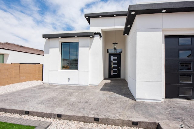 10660 E 45th Pl, Yuma, AZ 86367 - entrance to property featuring fence, a patio area, and stucco siding