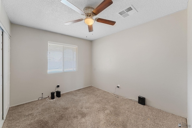 2213 W Pueblo St, Yuma, AZ 85364 - unfurnished bedroom with carpet floors, a closet, ceiling fan, and a textured ceiling