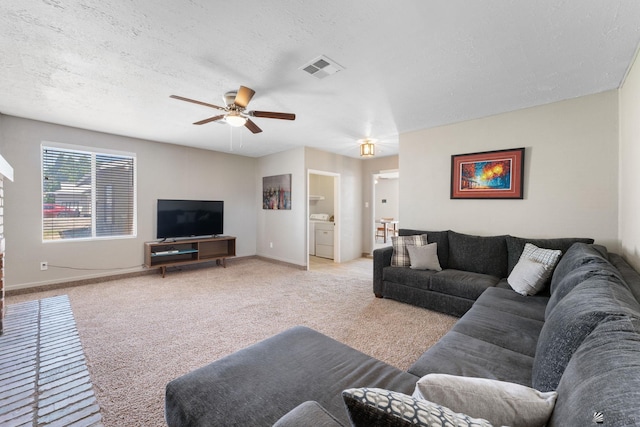 2213 W Pueblo St, Yuma, AZ 85364 - carpeted living room with a ceiling fan, baseboards, and a textured ceiling