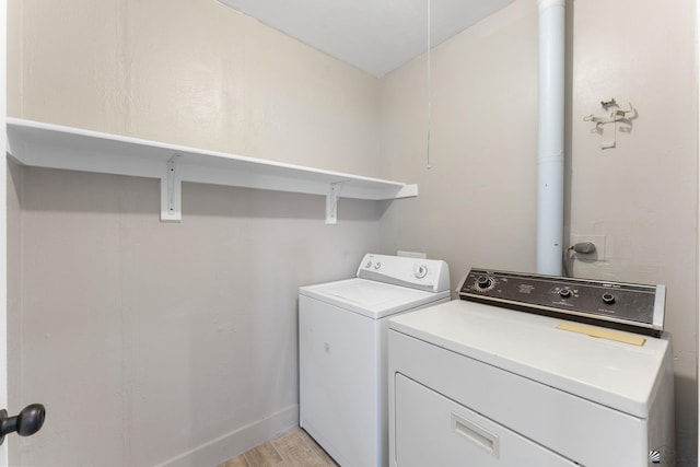 2213 W Pueblo St, Yuma, AZ 85364 - clothes washing area with washing machine and dryer and light wood-style floors