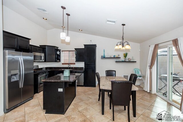 11635 E El Padre, Yuma, AZ 85367 - kitchen featuring appliances with stainless steel finishes, dark cabinetry, a chandelier, vaulted ceiling, and visible vents
