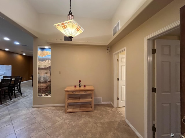 corridor featuring light tile patterned floors