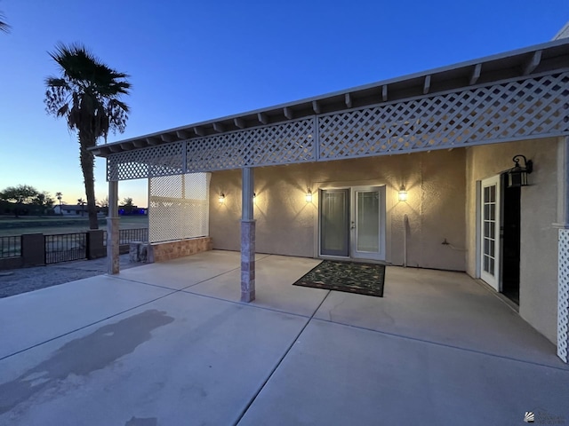 view of patio terrace at dusk