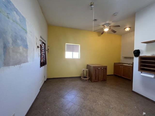 interior space featuring ceiling fan