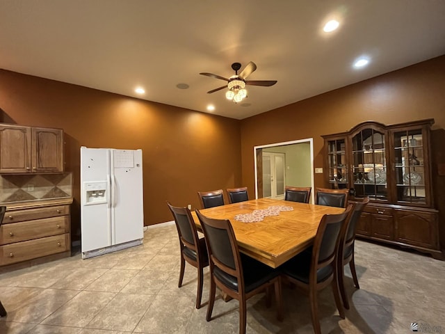 dining room with ceiling fan and light tile patterned flooring