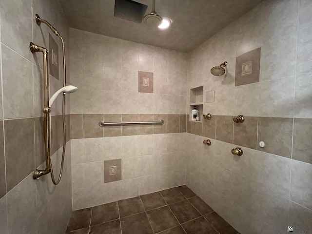 bathroom with a tile shower