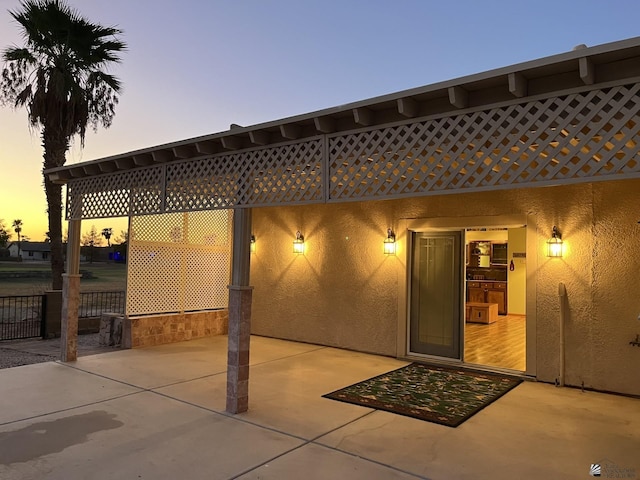 view of patio terrace at dusk