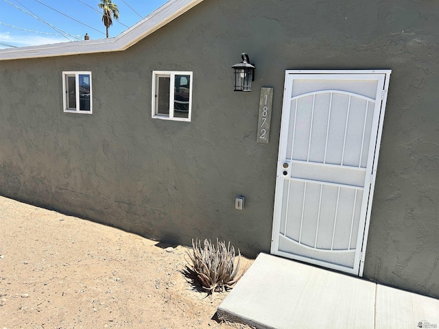 1872 S Walnut Ave, Yuma, AZ 85364 - property entrance featuring stucco siding