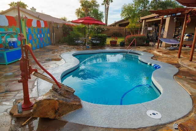 view of pool featuring fence, a fenced in pool, and a patio area