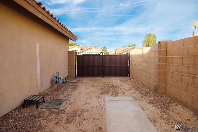 view of yard with a gate and fence