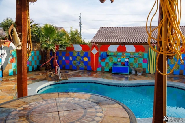 view of swimming pool with a fenced in pool, a patio area, and fence