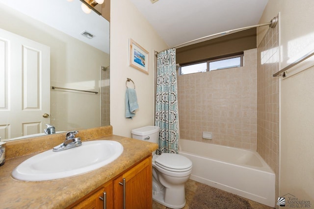 bathroom with shower / tub combo with curtain, vanity, toilet, and visible vents