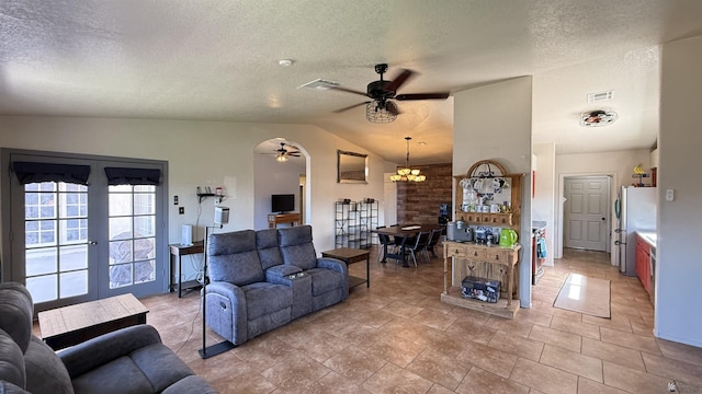 6311 E 42nd St, Yuma, AZ 85365 - living room with ceiling fan, lofted ceiling, a textured ceiling, french doors, and a chandelier