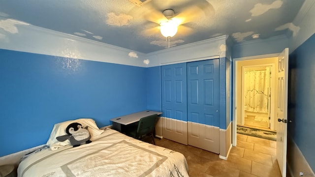 6311 E 42nd St, Yuma, AZ 85365 - bedroom with a closet, crown molding, a ceiling fan, and tile patterned flooring