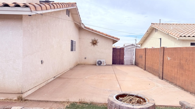 6311 E 42nd St, Yuma, AZ 85365 - view of patio featuring a fire pit and a gate