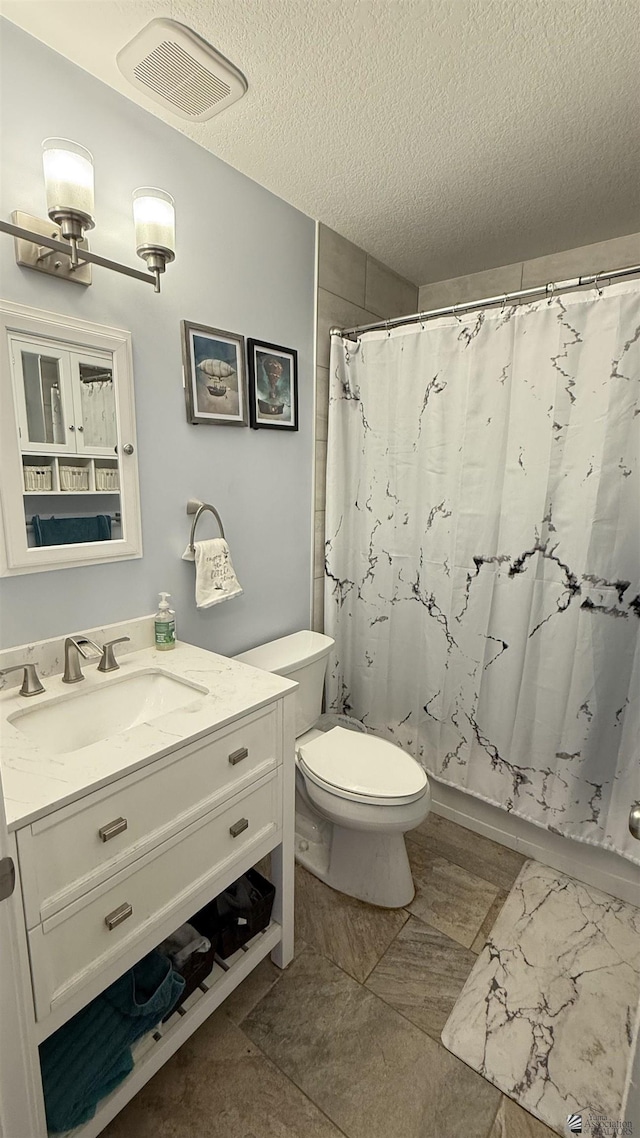6311 E 42nd St, Yuma, AZ 85365 - bathroom with vanity, a textured ceiling, and a shower with shower curtain