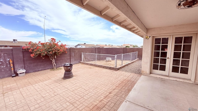 6311 E 42nd St, Yuma, AZ 85365 - fenced backyard featuring a patio and french doors