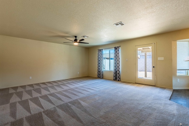 7959 E 43rd Pl, Yuma, AZ 85365 - carpeted empty room featuring baseboards, a textured ceiling, visible vents, and ceiling fan