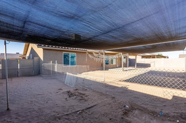 7959 E 43rd Pl, Yuma, AZ 85365 - rear view of property with fence, a patio, and stucco siding