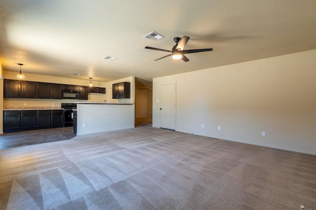 7959 E 43rd Pl, Yuma, AZ 85365 - unfurnished living room featuring visible vents, ceiling fan, and light colored carpet