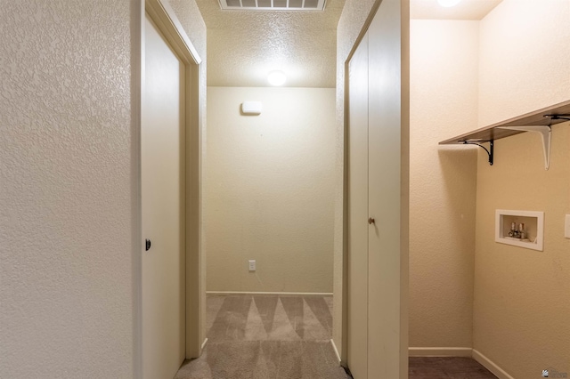 7959 E 43rd Pl, Yuma, AZ 85365 - corridor featuring carpet floors, a textured ceiling, baseboards, and visible vents