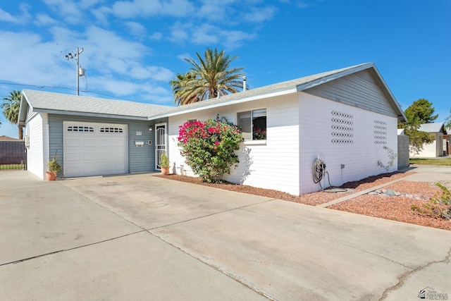 541 E Hacienda Dr, Yuma, AZ 85365 - ranch-style house with concrete driveway and an attached garage