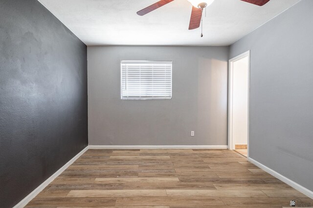 541 E Hacienda Dr, Yuma, AZ 85365 - spare room featuring a ceiling fan, wood finished floors, and baseboards