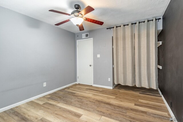 541 E Hacienda Dr, Yuma, AZ 85365 - spare room featuring ceiling fan, wood finished floors, and baseboards