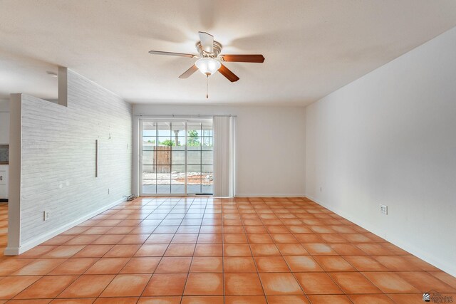 541 E Hacienda Dr, Yuma, AZ 85365 - spare room with ceiling fan, light tile patterned floors, and baseboards