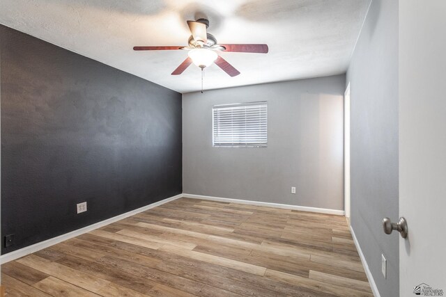541 E Hacienda Dr, Yuma, AZ 85365 - unfurnished room featuring a ceiling fan, wood finished floors, and baseboards