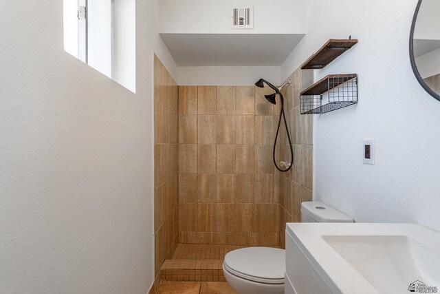 541 E Hacienda Dr, Yuma, AZ 85365 - bathroom featuring toilet, a tile shower, and vanity